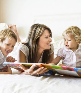 mother reading to kids babysitter